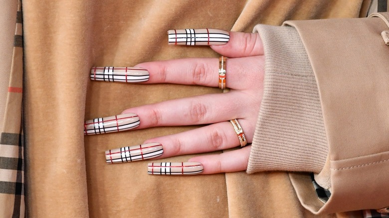 Billie Eilish with plaid nails