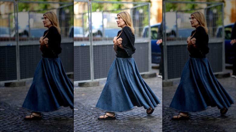 woman wearing pleated denim skirt