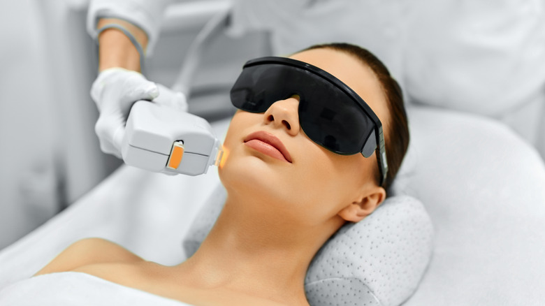 woman receiving laser treatment