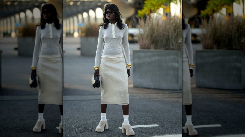 woman wearing all white outfit