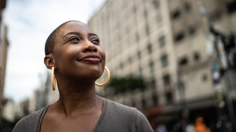 Woman on street appearing peaceful