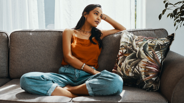 Woman sitting deep in thought