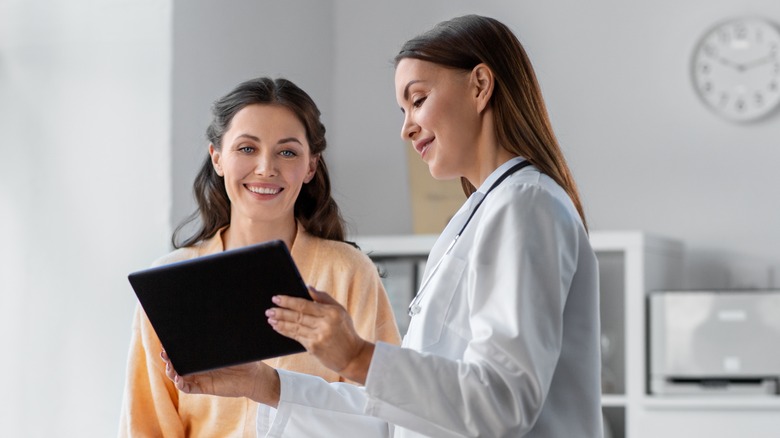 Woman talking to doctor