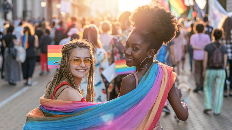 Young LGBTQ+ couple at pride parade