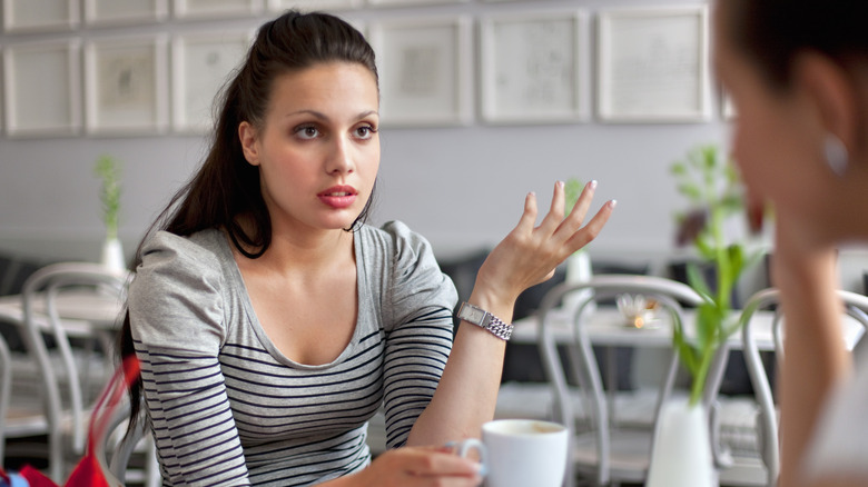 Woman looking annoyed with friend