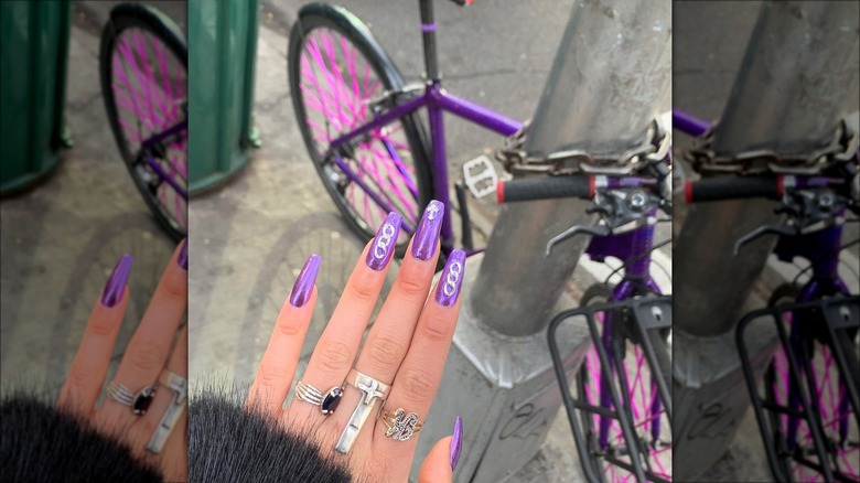 Woman with silver charms on her nails