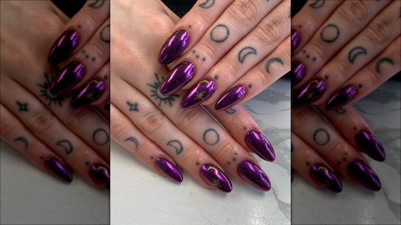 Woman with dark purple chrome nails