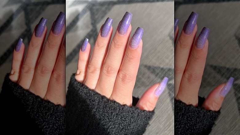 woman's hand purple gradient manicure