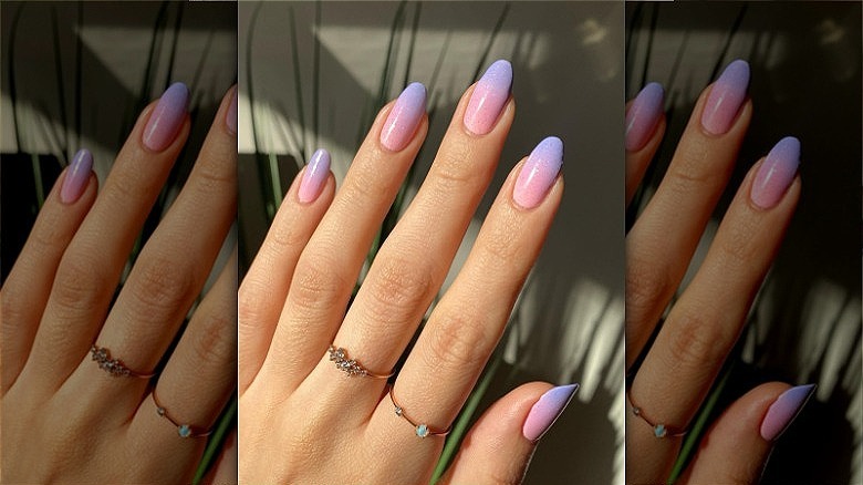 woman with purple pink ombre nails