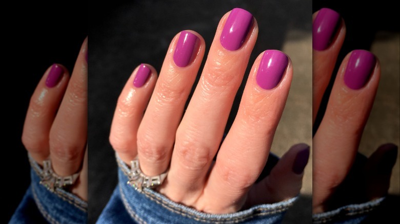 woman's hand purple barbiecore manicure