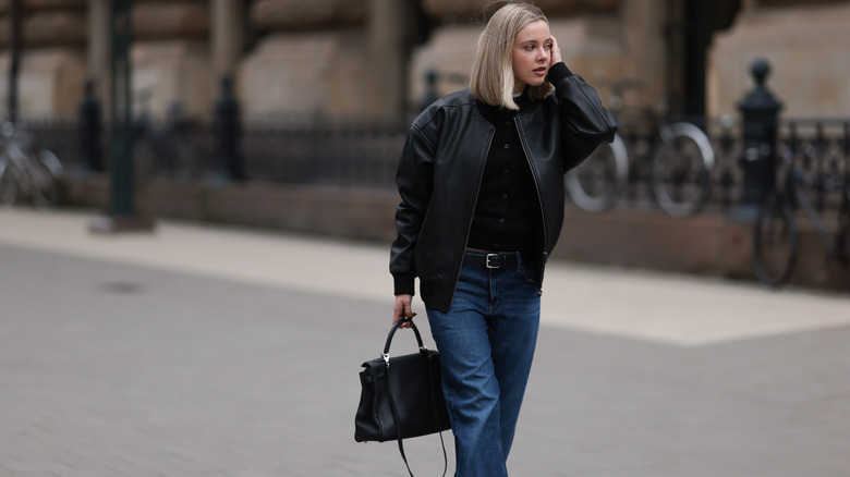 woman in dark-wash jeans