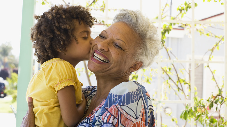 Granddaughter and grandmother showing affection