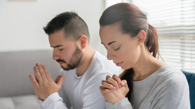 Couple praying together