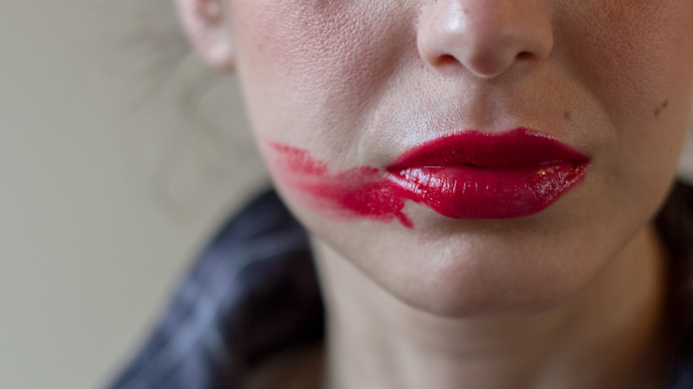 Lips with smudged lipstick