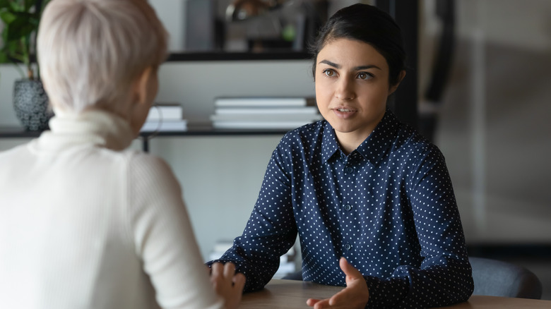 woman talking to manager