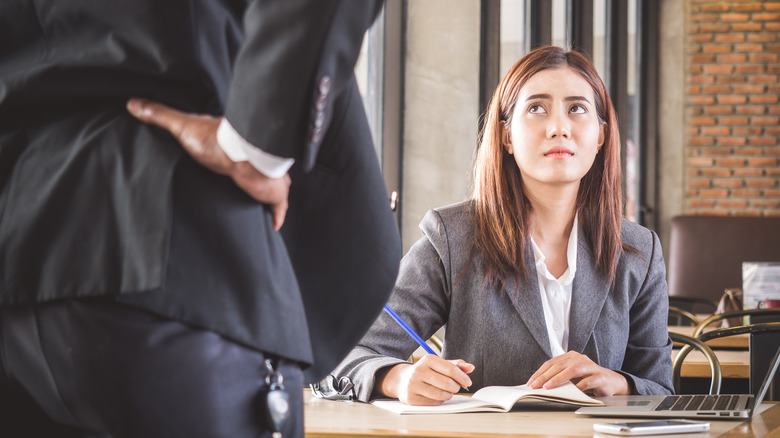 worried woman looking at manager