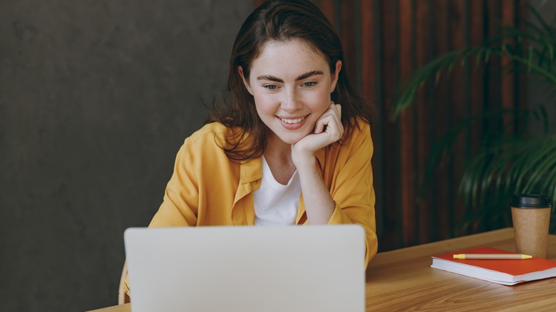 smiling woman at work desk