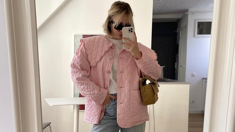 woman wearing pink quilted jacket