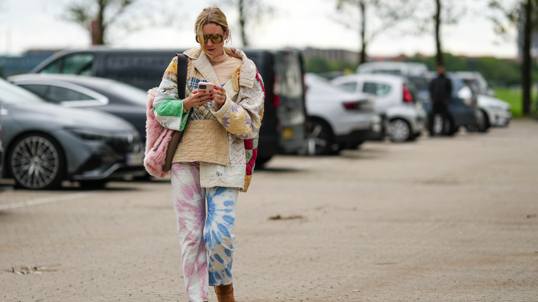 woman wearing patchwork quilted jacket