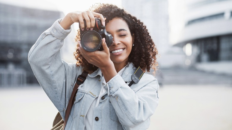 Woman taking photo with camera