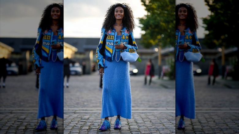 woman wearing blue racing jacket