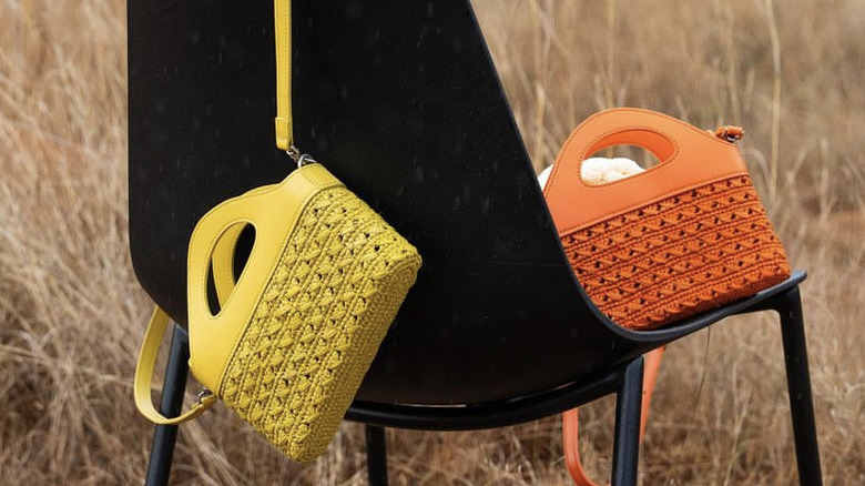 colored raffia bags on chair