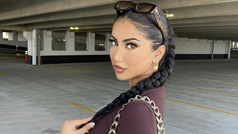 A woman with a braided ponytail
