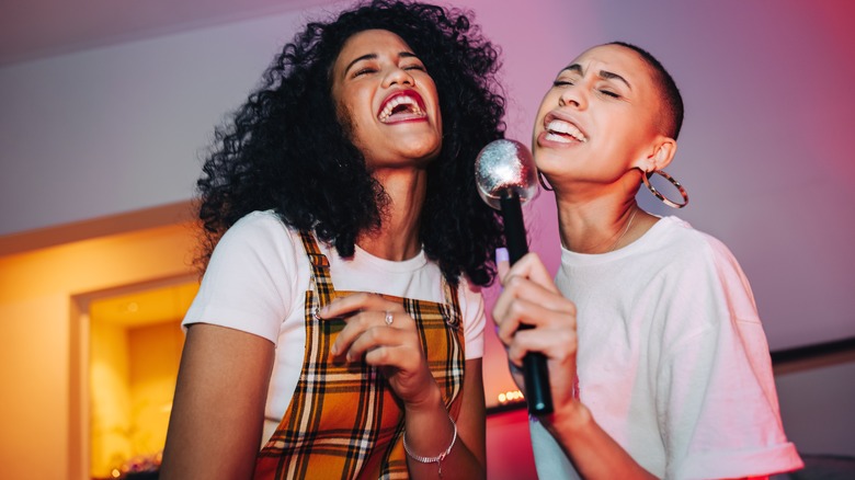 Women singing karaoke 