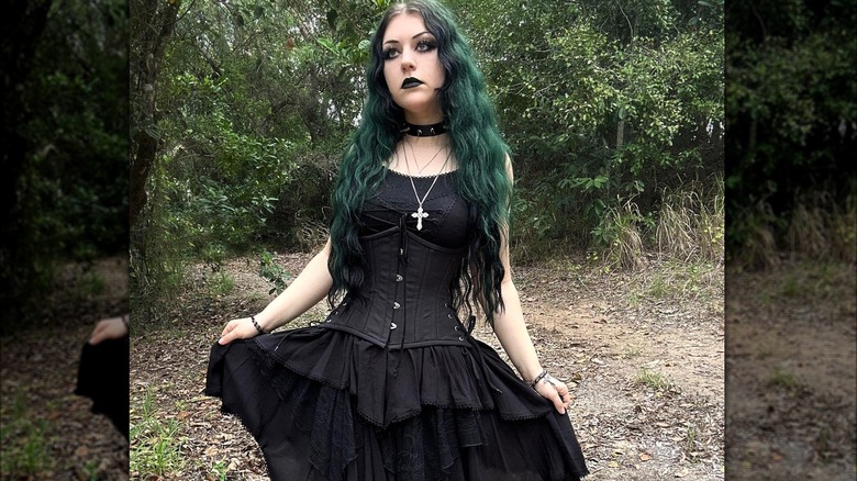Woman wearing black corset and skirt