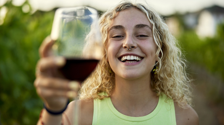 Woman drinking red wine