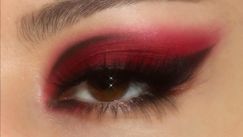 Red eyeshadow with graphic liner