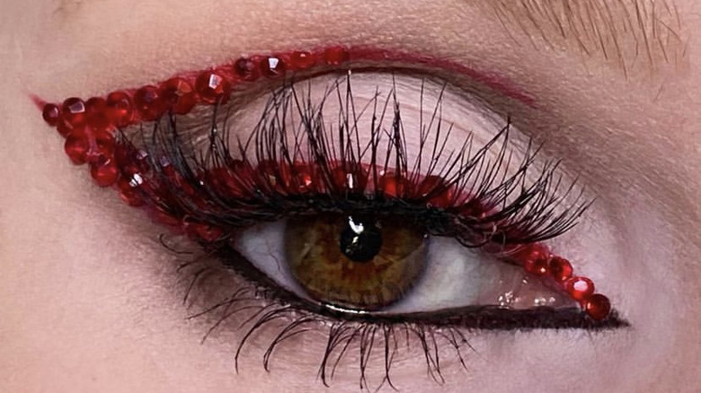 Eye with red eyeliner 