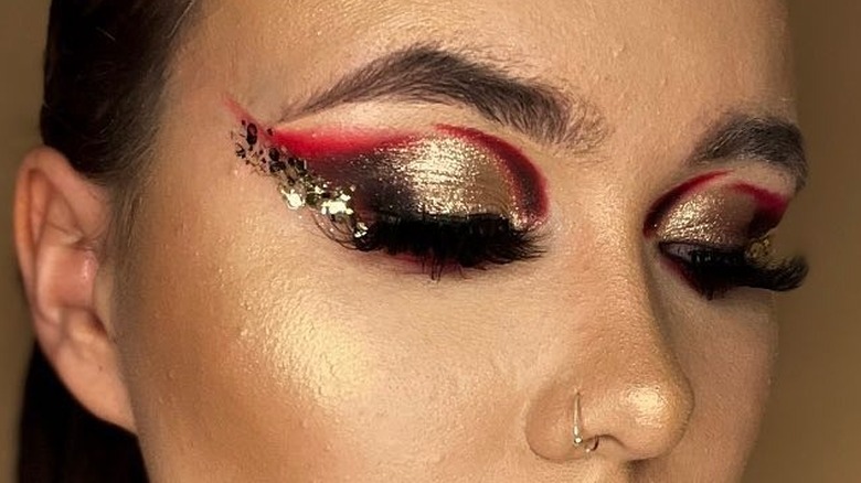 Gold eyeshadow with red accent