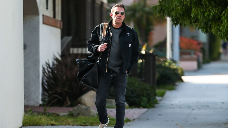 Ben Affleck walking alone in sunglasses