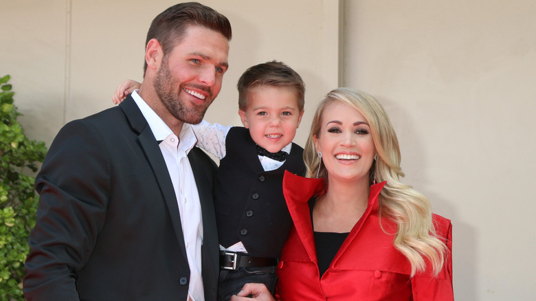 Carrie Underwood and Mike Fisher with their son.