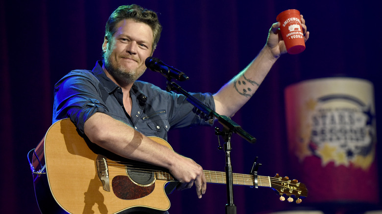 Blake Shelton holding red cup