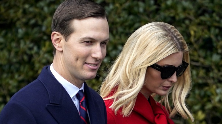 Jared Kushner and Ivanka Trump walking outside.