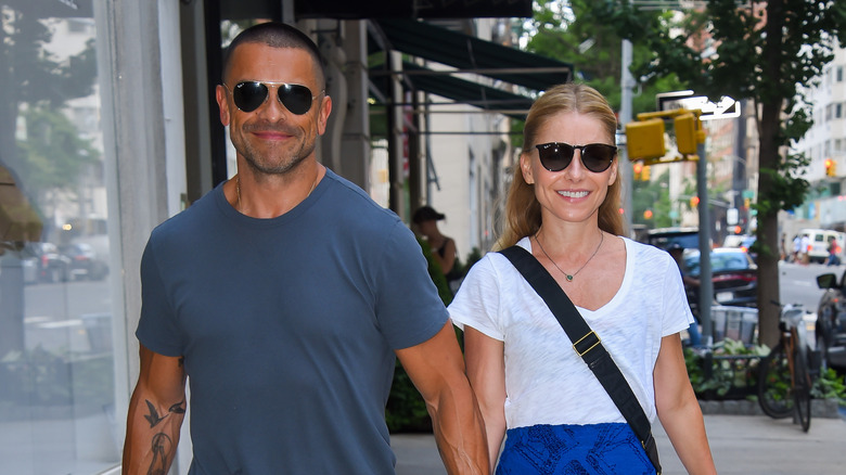 Kelly Ripa and Mark Consuelos taking a walk together.