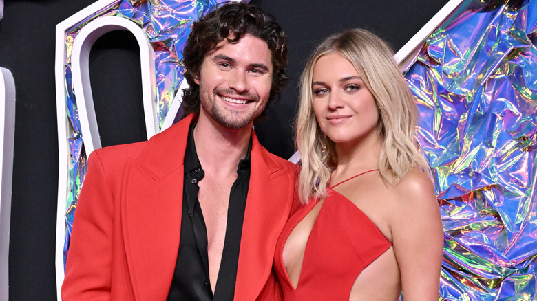 Chase Stokes and Kelsea Ballerini wearing red