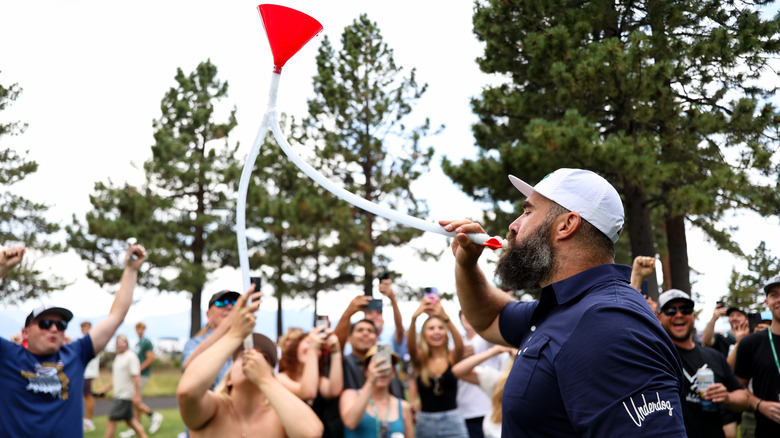 Jason Kelce drinking from a beer bong