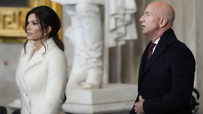 Lauren Sanchez walking ahead of Jeff Bezos