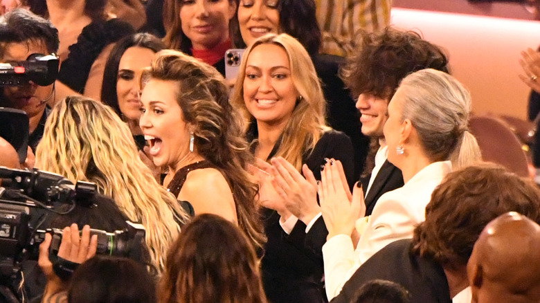 Miley Cyurs and Maxx Morando attending the 2024 Grammy Awards with Miley's sister and mom.