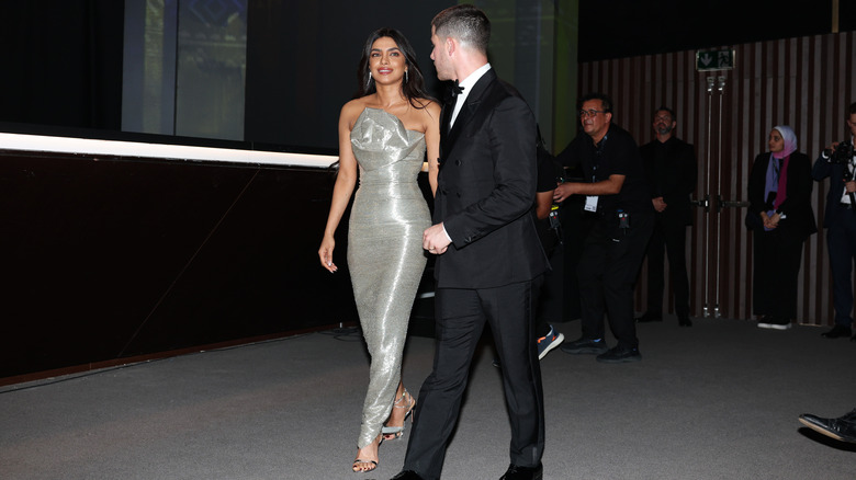 Nick Jonas married Priyanka Chopra headed towards an industry event.