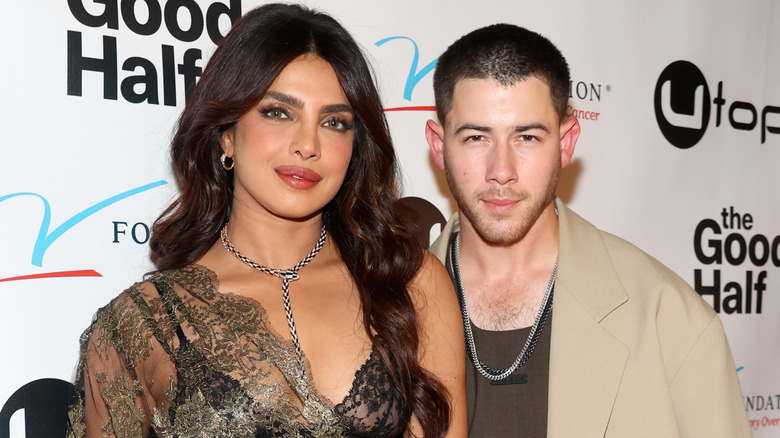 Priyanka Chopra and Nick Jonas posing together at a red carpet event.