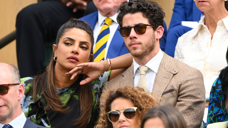 Priyanka Chopra and Nick Jonas attending a Wimbledon tennis match together.