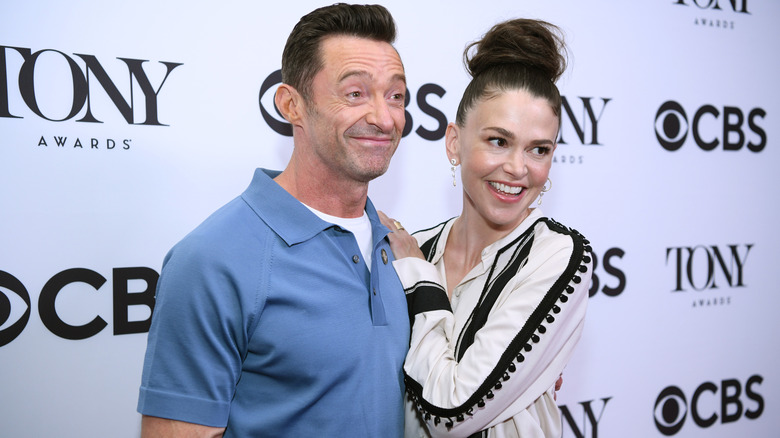 Sutton Foster and Hugh Jackman posing on a red carpet together.