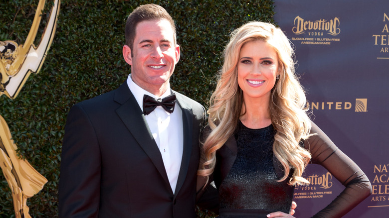 Tarek El Moussa and Christina Hall posing together at a red carpet event.