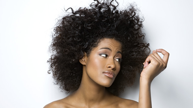 woman feeling hair texture