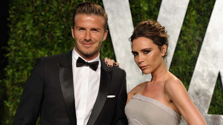 David Beckham black tux Victoria Beckham gray dress