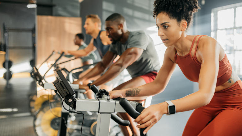 Men and women in a spin class